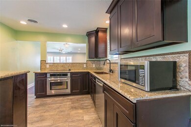 Extra thick granite, cherry cabinets to the ceilin