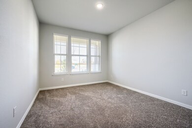 Unfurnished room featuring carpet flooring and baseboards