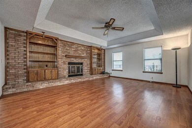 Unfurnished living room featuring wood-type floori