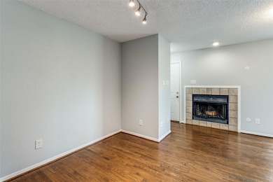 Unfurnished living room with baseboards, a firepla