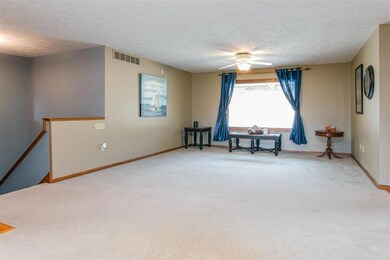 First Floor Living Room facing West. Stairway to l