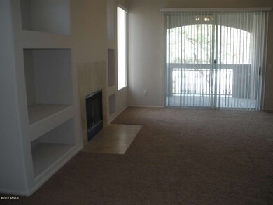great room with fireplace and built-ins