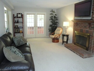 French doors lead to the brick patio, freshly painted interior and new carpeting throughout makes it move in ready!