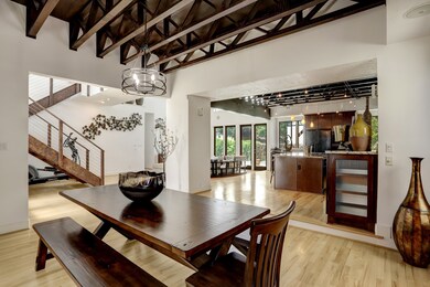 This view from dining area into the kitchen, entry