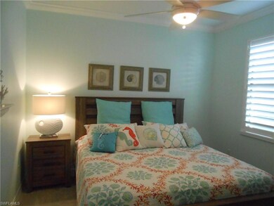 Bedroom featuring ceiling fan and crown molding