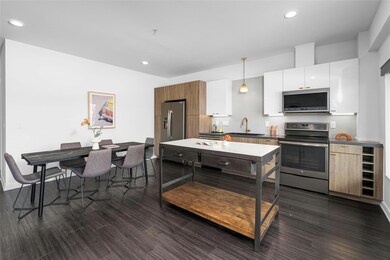 Kitchen with pendant lighting, a sink, appliances