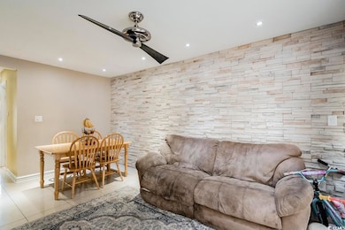 Tiled living area featuring recessed lighting and 