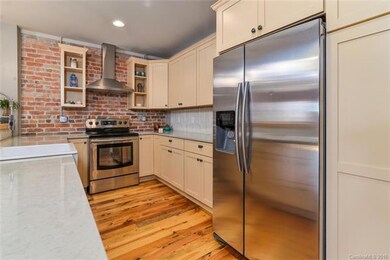 Remodeled kitchen with tin backsplash