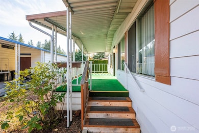 As you come to the front door you are greeted with easy to maintain landscaping and a large front porch.