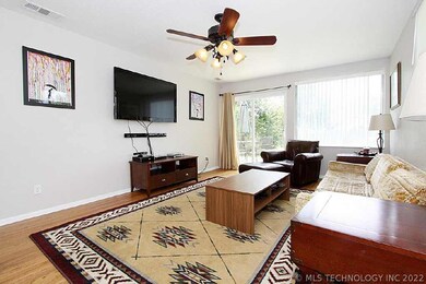 Enter the family room with lovely wood floors, lig