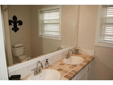 Other. hallway bathroom with double sinks