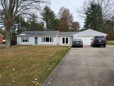 Single story home with a front lawn