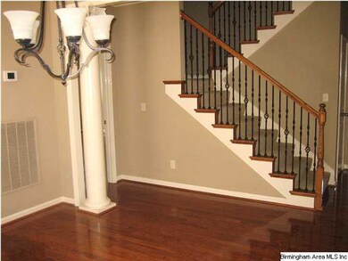 View of the stairs looking from the dining room