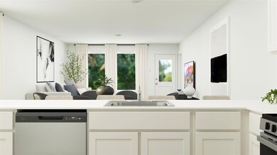 Kitchen featuring white cabinetry, a sink, and sta