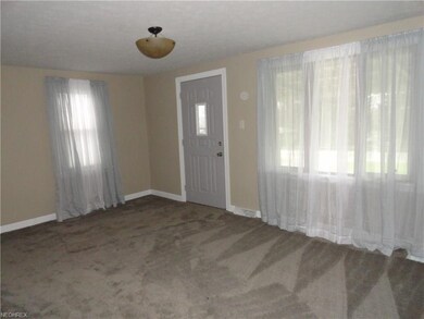 Comfortable living room with new carpeting.