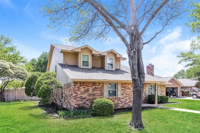 View of front of house with roof with shingles, a 