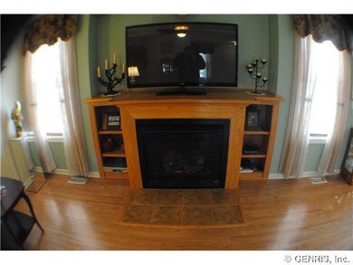 Living Room Built-in gas fireplace with oak mantle