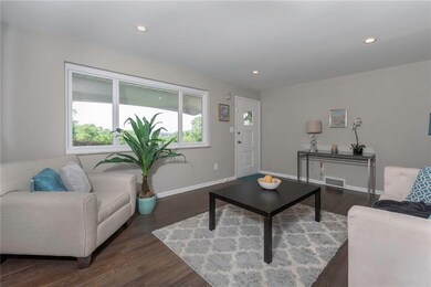 The Large Picture Window Floods the Living Room Wi