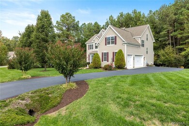 View of front of property with front lawn and 3-ca