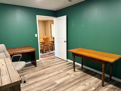 Home office featuring light wood-style flooring, 