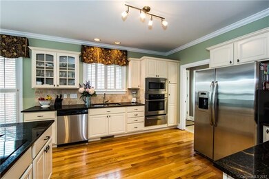Kitchen with custom cabinets, granite counters, SS
