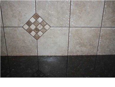 A closer look at the granite and backsplash.