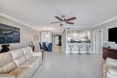 Living room featuring ceiling fan, light tile patt