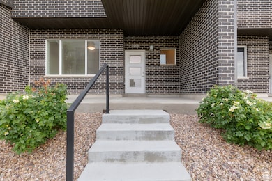 Entrance to property with brick siding