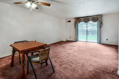Living/dining space.  Walk right out to your patio