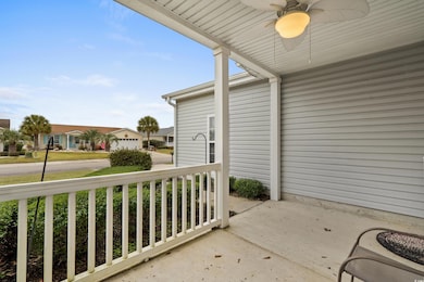 View of patio featuring ceiling fan and covered po