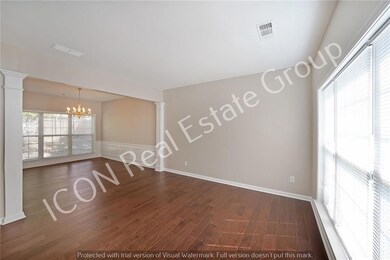 Empty room with dark wood-style floors, a notable 