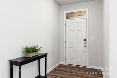 The generous entry with a window over the door to let in extra light without sacrificing privacy.