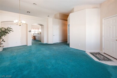 Living room/dining room combo. Entrance to home on