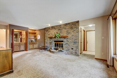 family room with fireplace & wet bar