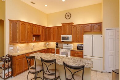 Kitchen with granite counters and oak cabinets and