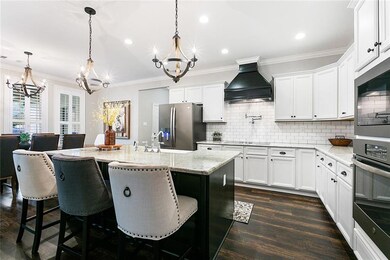 Bright kitchen with farmhouse sink and pull out sh