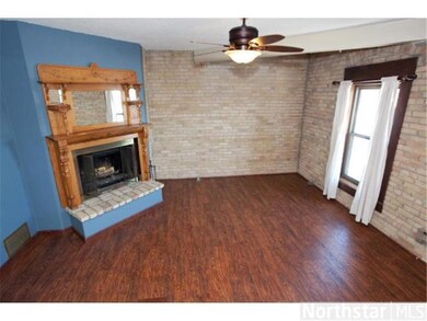 Beautiful ornate wood burin gin fireplace. Windows