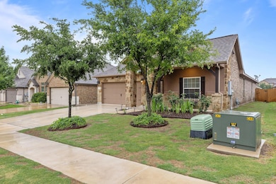 View of front facade featuring concrete driveway,