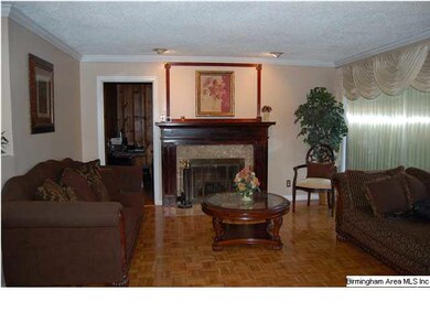 Large livingroom area with marbled surround wood b
