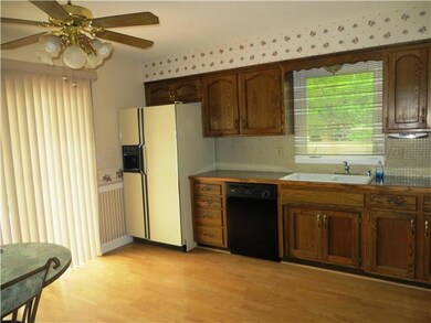Eat-in kitchen walks out to deck and pool.