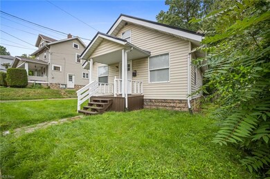 Bungalow-style house with a front lawn