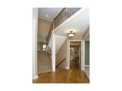 Staircase to second floor with decorative iron spi