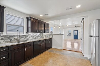kitchen with generous cabinetry and counter space