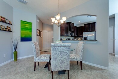 Great color palette in Kitchen with archway, dinin