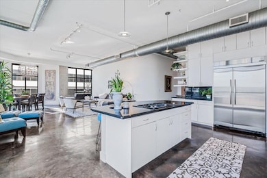 Kitchen featuring finished concrete floors, dark 