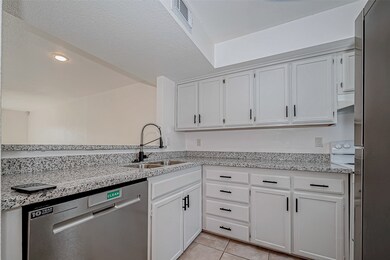 Cabinets, countertops, and natural light—this kitc
