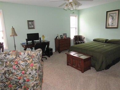 large master bedroom with a full bath.