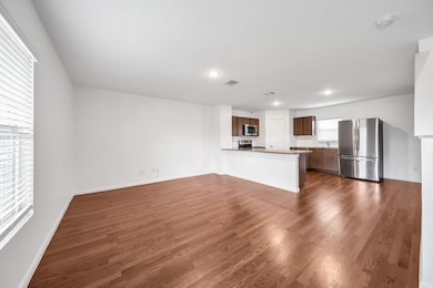 Open concept living abounds with kitchen open to l