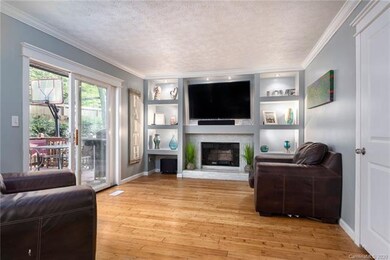 Beautiful living room with built in book shelves, 