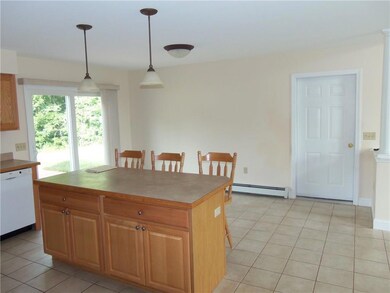 ISLAND BETWEEN THE KITCHEN AND...